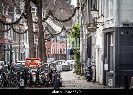 Picture of a bunch of bicycles, parked and stacked in the city center of Maastricht, netherlands.Bicycle parking lot in Maastricht, Netherlands. This Stock Photo