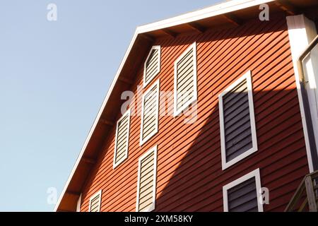 Low angle view of a old red wooden building Stock Photo