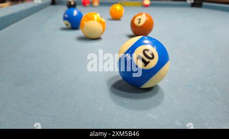 Close up of Pool balls on gray table sport game set known as eight ball pool, six pockets, cue sports. Stock Photo