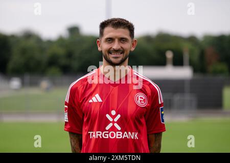 Duesseldorf, Germany. 25th July, 2024. Soccer: Bundesliga 2, Fortuna Düsseldorf photo shoot. Matthias Zimmermann. Credit: Marius Becker/dpa - IMPORTANT NOTE: In accordance with the regulations of the DFL German Football League and the DFB German Football Association, it is prohibited to utilize or have utilized photographs taken in the stadium and/or of the match in the form of sequential images and/or video-like photo series./dpa/Alamy Live News Stock Photo