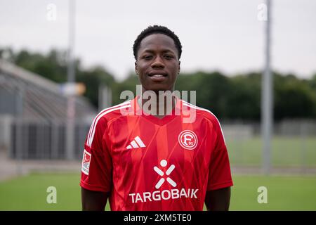 Duesseldorf, Germany. 25th July, 2024. Soccer: Bundesliga 2, Fortuna Düsseldorf photo shoot. King Manu. Credit: Marius Becker/dpa - IMPORTANT NOTE: In accordance with the regulations of the DFL German Football League and the DFB German Football Association, it is prohibited to utilize or have utilized photographs taken in the stadium and/or of the match in the form of sequential images and/or video-like photo series./dpa/Alamy Live News Stock Photo