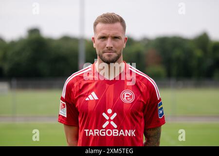 Duesseldorf, Germany. 25th July, 2024. Soccer: Bundesliga 2, Fortuna Düsseldorf photo shoot. Andre Hoffmann. Credit: Marius Becker/dpa - IMPORTANT NOTE: In accordance with the regulations of the DFL German Football League and the DFB German Football Association, it is prohibited to utilize or have utilized photographs taken in the stadium and/or of the match in the form of sequential images and/or video-like photo series./dpa/Alamy Live News Stock Photo