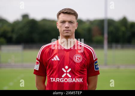 Duesseldorf, Germany. 25th July, 2024. Soccer: Bundesliga 2, Fortuna Düsseldorf photo shoot. Dzenan Pejcinovic. Credit: Marius Becker/dpa - IMPORTANT NOTE: In accordance with the regulations of the DFL German Football League and the DFB German Football Association, it is prohibited to utilize or have utilized photographs taken in the stadium and/or of the match in the form of sequential images and/or video-like photo series./dpa/Alamy Live News Stock Photo