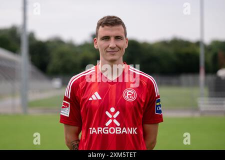 Duesseldorf, Germany. 25th July, 2024. Soccer: Bundesliga 2, Fortuna Düsseldorf photo shoot. Marcel Sobottka. Credit: Marius Becker/dpa - IMPORTANT NOTE: In accordance with the regulations of the DFL German Football League and the DFB German Football Association, it is prohibited to utilize or have utilized photographs taken in the stadium and/or of the match in the form of sequential images and/or video-like photo series./dpa/Alamy Live News Stock Photo