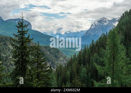 Immerse yourself in the grandeur of Dolomite summits while trekking to the serene Lago di Sorapis. Stock Photo