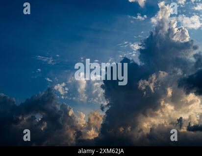 It's sunset time. Storm clouds. Dark clouds in the sky before the rain. Cumulonimbus clouds before rain. Stock Photo