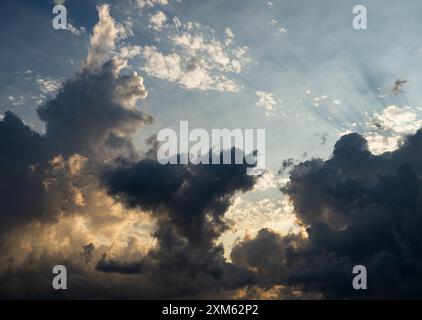 It's sunset time. Storm clouds. Dark clouds in the sky before the rain. Cumulonimbus clouds before rain. Stock Photo
