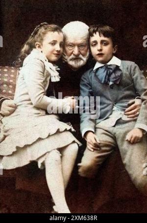 Victor Hugo with Georges and Jeanne on his lap. 1881 - photo after Achille Melandri (1845-1905)  Later coloring Stock Photo