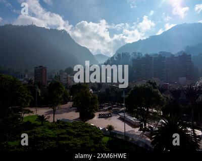 Bogota, Colombia - Dec, 2022:  Parque de Los Periodistas -Journalists' Park in Bogota and view on the Monserrate Hill during the foggy morning. La Can Stock Photo