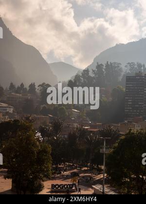 Bogota, Colombia - Dec, 2022:  Parque de Los Periodistas -Journalists' Park in Bogota and view on the Monserrate Hill during the foggy morning. La Can Stock Photo