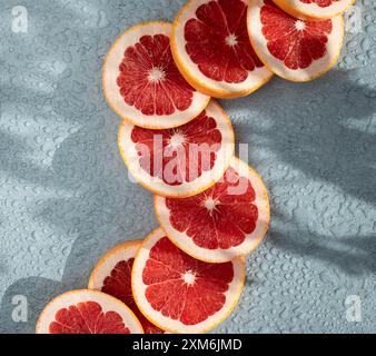 sliced blood oranges covered in water on a table Stock Photo