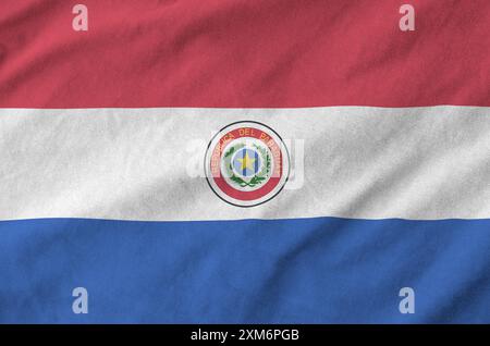 Paraguay flag depicted on folded wavy fabric of old cloth close up Stock Photo