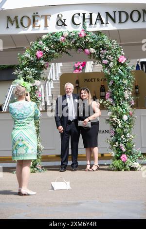 Ascot, Berkshire, UK. 26th July, 2024. Racegoers arriving at Ascot Racecourse in Berkshire on a sunny day for the QIPCO King George Friday. Credit: Maureen McLean/Alamy Live News Stock Photo