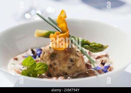 Chanterelles in herb cream with bread dumplings Stock Photo