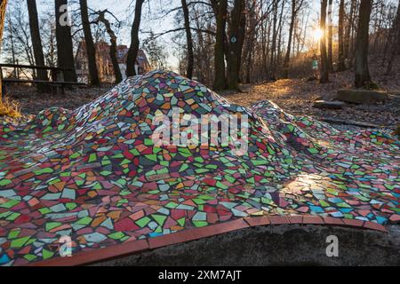 Sobotka, Poland - January 29 2024: Beautiful colorful mosaic construction with massif of Sleza mountains below the mountain at crossing of trails Stock Photo