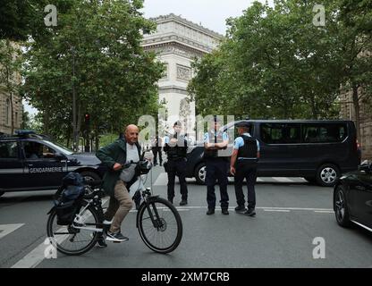 Paris, France. 26th July, 2024. French Police close the roads and step up security ahead of the Olympics opening ceremony tonight in Paris, France on Friday, July 26, 2024. Earlier today an arson attack on the French railway network has caused major delays ahead of the opening ceremony. Photo by Hugo Philpott/UPI Credit: UPI/Alamy Live News Stock Photo