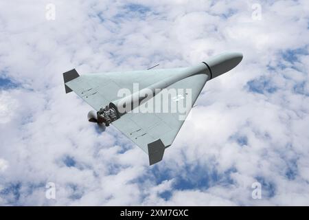 Military kamikaze drone in the sky against the background of missile trails and clouds, drone attack. Stock Photo