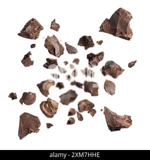 Dark chocolate flakes explosion, isolated on white background. Stock Photo