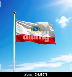 Waving flag of Saratov is a region of Russia on flagpole with sky background. Stock Photo