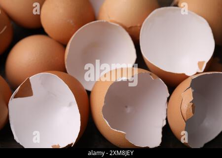 Pieces of broken eggshells on table, closeup Stock Photo