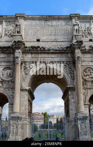 Rome, Italy - October 1, 2019: Majestic ancient arch monument with intricate carvings under a cloudy sky. Stock Photo