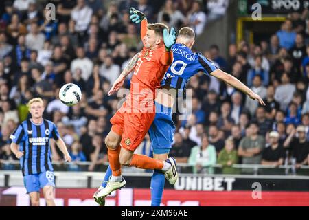 Brugge, Belgium. 26th July, 2024. Mechelen's goalkeeper Ortwin De Wolf and Club's Gustaf Nilsson pictured in action during a soccer match between Club Brugge KV and KV Mechelen, Friday 26 July 2024 in Brugge, on the opening day of the 2024-2025 season of the 'Jupiler Pro League' first division of the Belgian championship. BELGA PHOTO TOM GOYVAERTS Credit: Belga News Agency/Alamy Live News Stock Photo