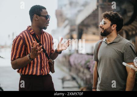 Two business people discussing work in an engaging outdoor meeting Stock Photo