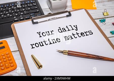 Handwriting text writing Your Daily Routine Matters on notebook. Stock Photo