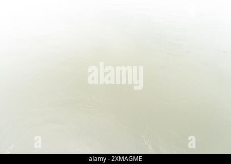 Full frame top view of calm white water surface is used as natural background texture in decorative art work. Stock Photo