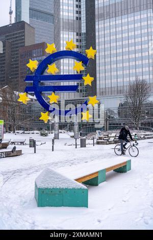 Winter in Frankfurt, euro sculpture at Willy-Brandt-Platz, snow-covered, Hesse, Germany Stock Photo