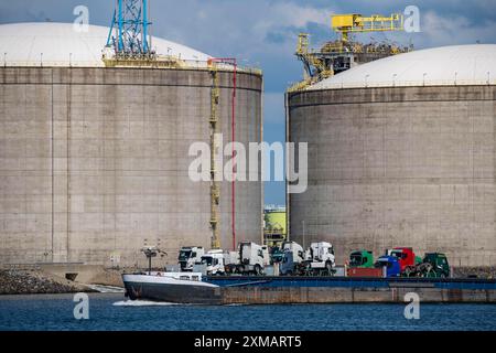 LNG import terminal tanks for liquefied natural gas in the seaport of Rotterdam, Maasvlakte, inland cargo ship, loaded with lorry tractors, Rotterdam Stock Photo