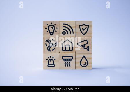 Innovative Technology: Man's Hand Holding Wooden Blocks Representing Smart Home Automation and Security in Digital Era. Stock Photo