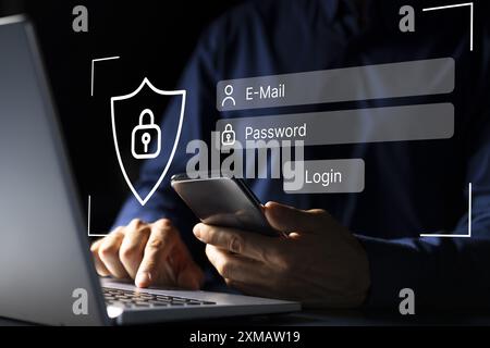 Tech-savvy young man typing on laptop for secure login into social media account with cybersecurity background concept. Stock Photo