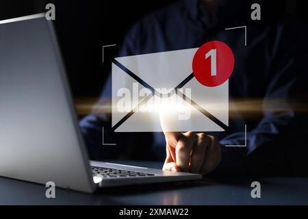Potential Professions Unveiled: photo captures a young Caucasian man typing furiously on his laptop, possibly updating software for a global tech comp Stock Photo