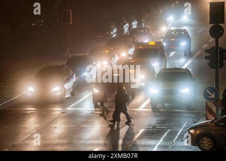 City centre traffic, fog, traffic jam, autumn, winter, evening rush hour traffic, Alfredstrasse B224, pedestrian crossing, Essen, North Stock Photo