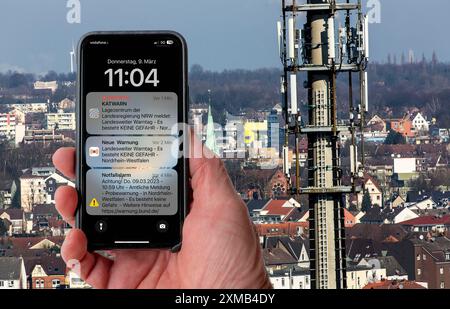 Symbolic image Cell Broadcast, warning service via mobile phone, by SMS, to all devices located in the area of radio cells, transmission masts, which Stock Photo