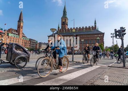 Cyclists on cycle paths, Radhuspladsen, City Hall Square, in the city centre of Copenhagen, considered the cycling capital of the world, 45 % of the Stock Photo