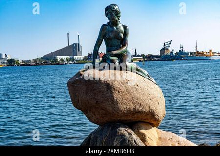 The Little Mermaid statue, Den lille Havfrue in Danish, on the Langelinie waterfront promenade in Copenhagen, is considered the smallest landmark in Stock Photo