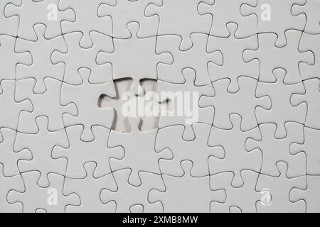 Puzzle game, blank, white, without motif, for printing, one piece missing Stock Photo