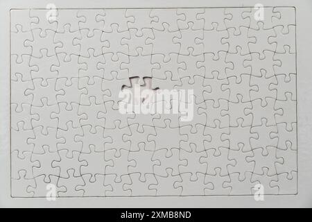 Puzzle game, blank, white, without motif, for printing, one piece missing Stock Photo