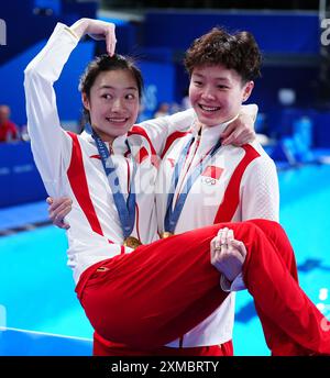 Yiwen Chen of China, gold, and Yani Chang of China, bronze show the ...