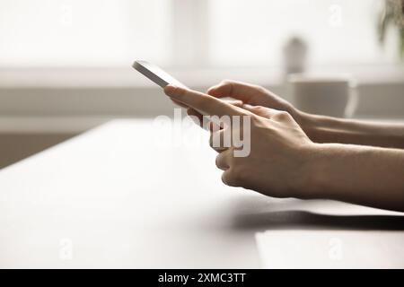 Close up view unknown female hands holding modern smart phone Stock Photo