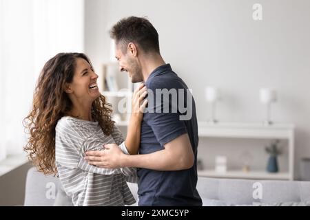 Happy spouses enjoy tender family weekend together at home Stock Photo