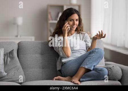 Pretty woman talking with friend on the phone Stock Photo