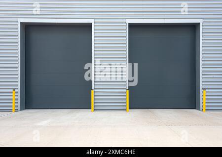 Exterior of an industrial unit with metal roller shutter doors Stock Photo