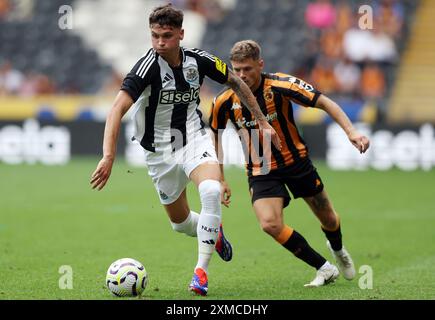 Newcastle United's Jamie Miley (left) battle for the ball with Hull City's Regan Slater during the pre-season friendly match at MKM Stadium, Hull. Picture date: Saturday July 27, 2024. Stock Photo