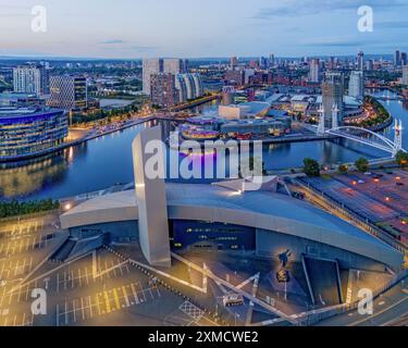 Manchester, england. Imperial War museum North and Salford Quays at dusk. Aerial view of the Manchester landmarks and skyline Stock Photo