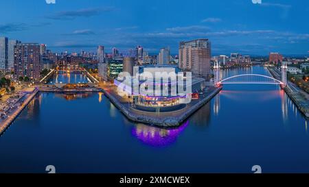 Manchester, England Ariel view of Salford Quays, waterfront, Imperial War Museum, BBC Studios, he Lowry. Skyline of Manchester, Old Trafford at dusk Stock Photo