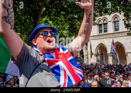 London, England.  27 Jul 24.  Tommy Robinson and Jeremy Corbyn go head to head with march and counter protest: Tommy Robinson today fronted a march billed as a 'Patriotic Rally' from the Strand to Trafalgar Square to 'unite the Kingdom'.  Thousands of self-proclaimed 'patriots' travelled from across the country to Central London to hear him speak.  Meanwhile,  Jeremy Corbyn led a counter-protest organised by 'Stand Up to Racism' in an attempt to 'stop Tommy Robinson'.  Credit: Lab Ky Mo/ALAMY LIVE NEWS Stock Photo