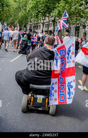 London, England.  27 Jul 24.  Tommy Robinson and Jeremy Corbyn go head to head with march and counter protest: Tommy Robinson today fronted a march billed as a 'Patriotic Rally' from the Strand to Trafalgar Square to 'unite the Kingdom'.  Thousands of self-proclaimed 'patriots' travelled from across the country to Central London to hear him speak.  Meanwhile,  Jeremy Corbyn led a counter-protest organised by 'Stand Up to Racism' in an attempt to 'stop Tommy Robinson'.  Credit: Lab Ky Mo/ALAMY LIVE NEWS Stock Photo